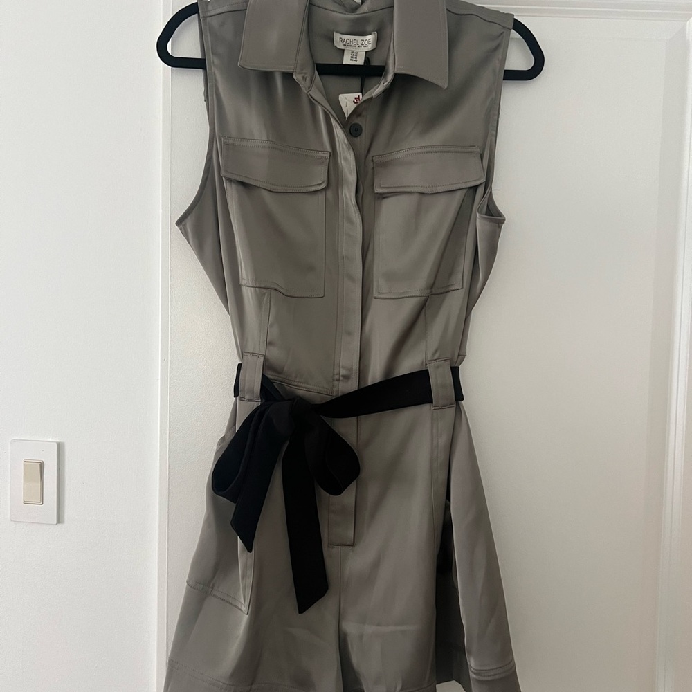 New with tags  romper. Can use any belt.  Buckle belt or tie belt